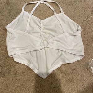 spaghetti strap white tank top. in the back has a clear ring